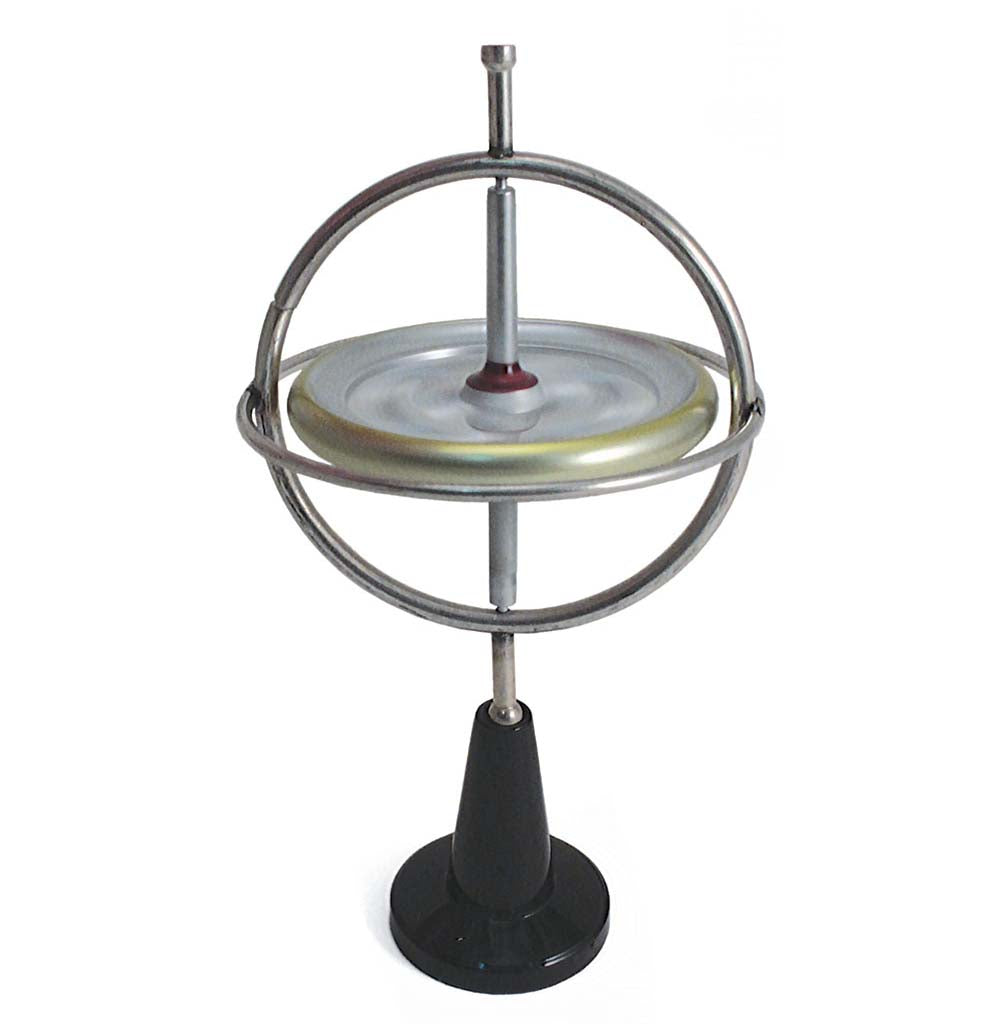  Rapidly spinning silver and gold mounted disc in gimbal rings sit on a black stand.
