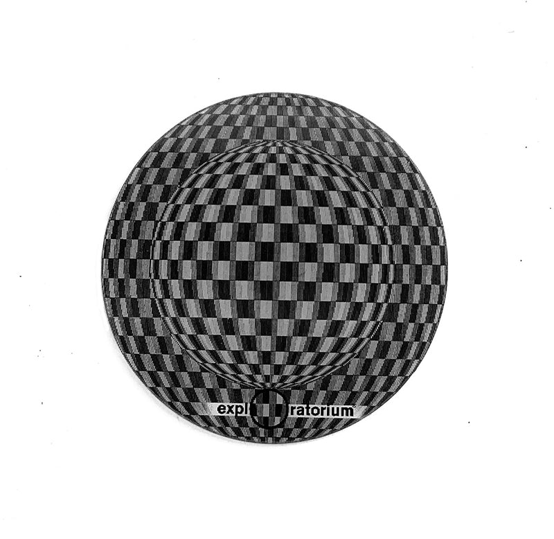 Black and grey circular lenticular sticker that appears as if a ball is moving across it.