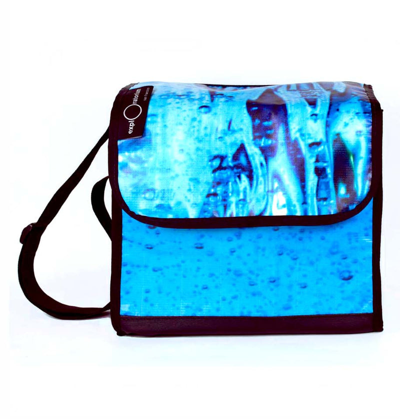Blue water print bike pannier with black strap and edging.