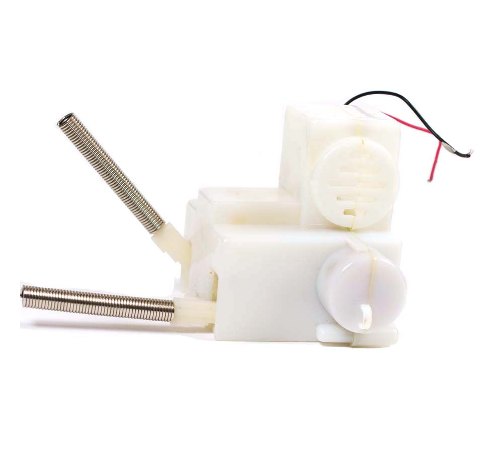 There is a white and silver kicking legs mechanism from a plush toy.