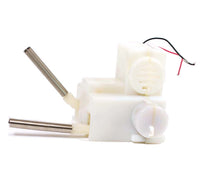 There is a white and silver kicking legs mechanism from a plush toy.