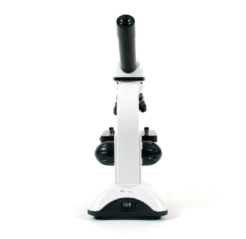 The microscope is 5.1 x 6.1 x 12.2 inches in dimension. It has a white body with black turning knobs, eyepiece, magnifying glass lenses, and a slide mount. Back facing.