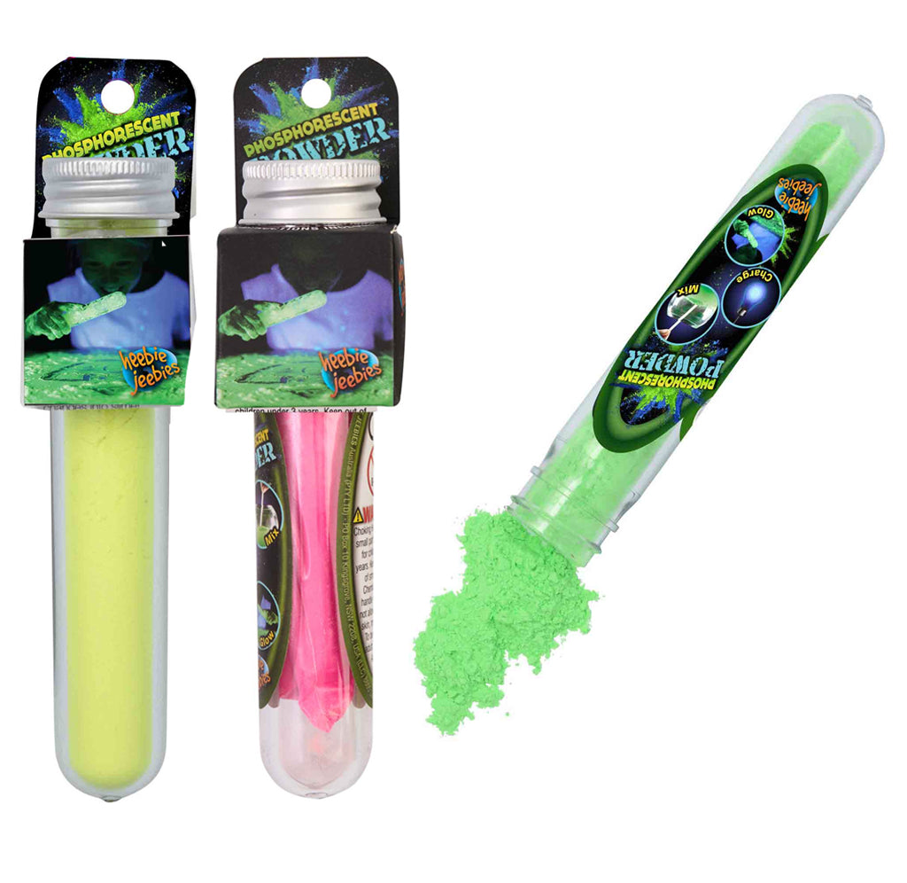 Three plastic test tubes are filled with glowing yellow, pink, and green powder.