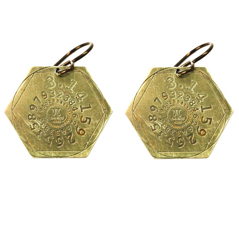 Golden hexagon earrings with the numbers of pi in a spiral. The symbol for pi is engraved in the center, as well as the word "shrine."