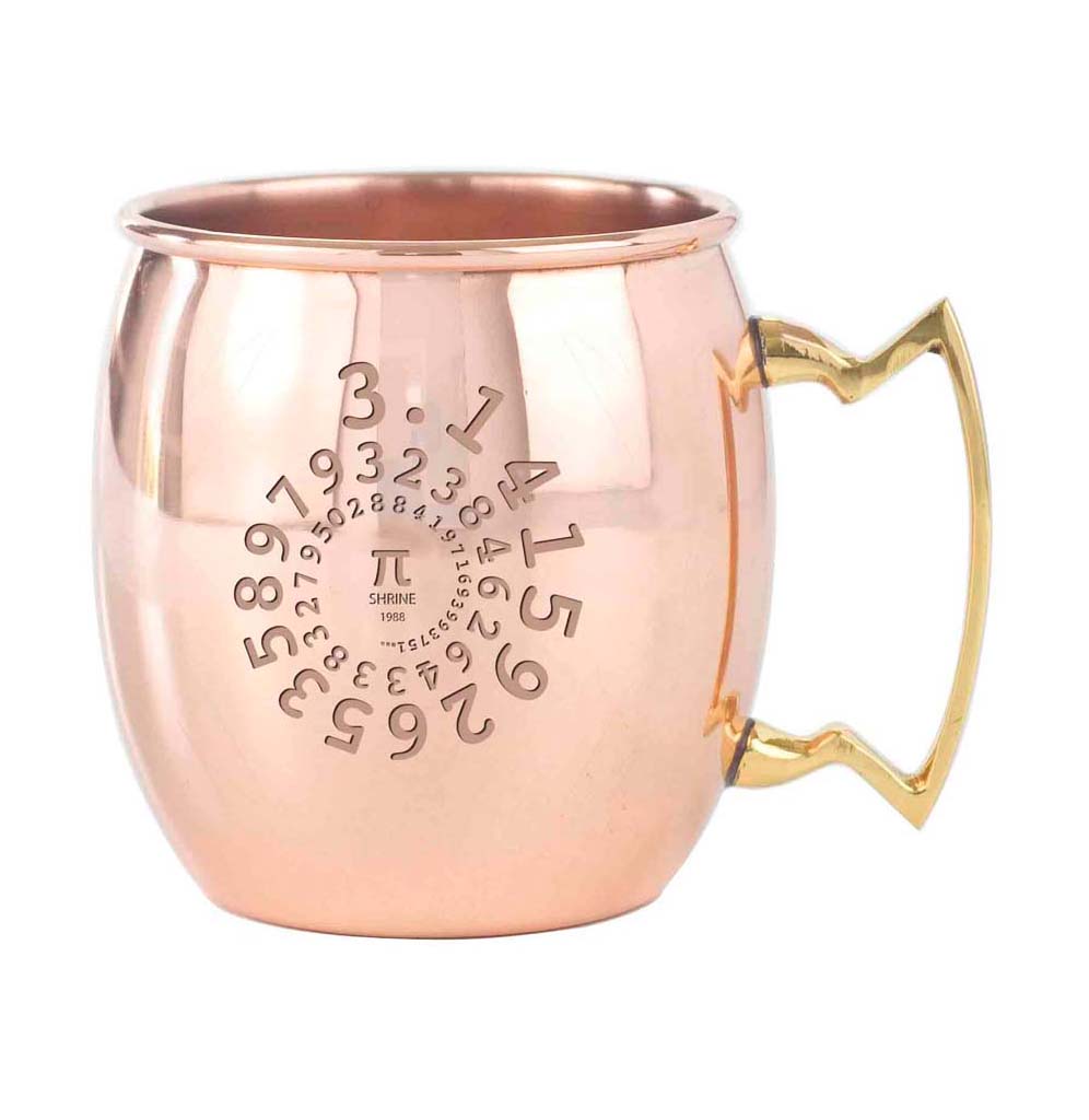 The Exploratorium Pi Shrine Moscow Mule Mug is a copper mug with a brass handle. The Exploratorium's own Pi Shrine is etched on the front. The digits of Pi moves in a circular design, gradually getting smaller trailing off to a Pi symbol in the middle. 