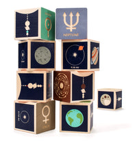 There are two stacks of eight blocks with Mercury. Venus. Earth. Mars. Jupiter. Saturn. Uranus. Two debossed sides feature the planet’s symbol, name, and several moons. The four printed sides reveal a planet illustration, diameter, location, and distance from the sun. 