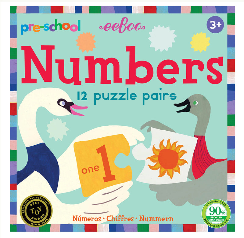 The game's cover illustrates a gray duck and a white swan holding the puzzle pieces for one and the sun. 