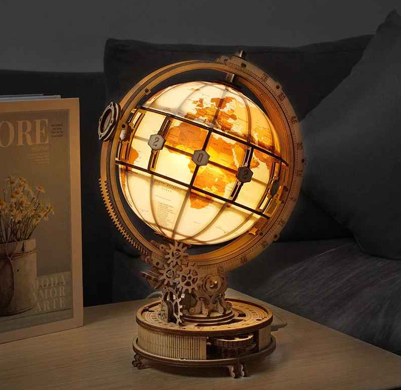 The Luminous Globe kit is put together and sits on a table with the lighting feature to illuminate the globe.