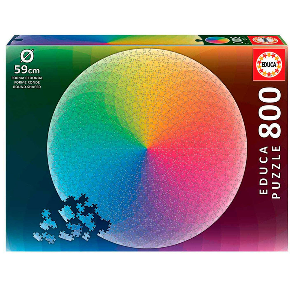 Rainbow-colored box with a rainbow circular puzzle sitting in the middle of the box. 