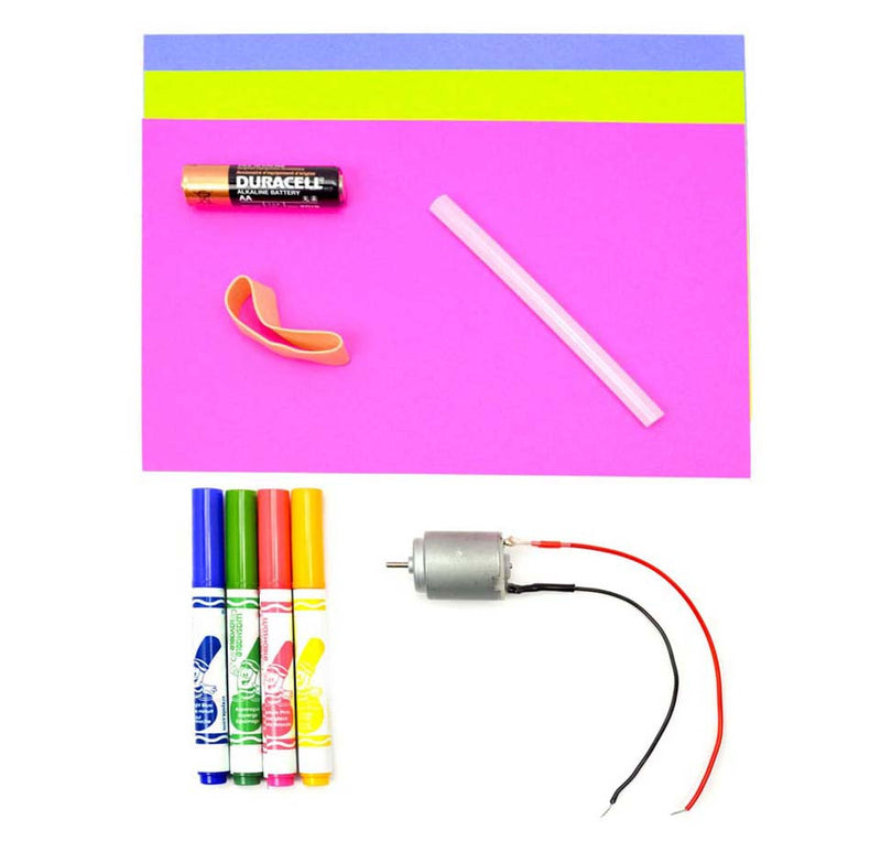 All the parts that are in the kit are displayed. There are three sheets of paper in pink, blue, and yellow, an AA battery, a rubber band, a glue stick, a three-volt motor, and four markers.