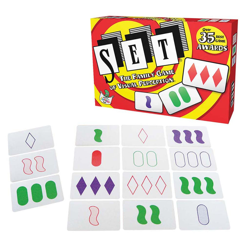 The game is set up for play along with the red, yellow, and black game box. There are three sets of four cards with solid or outlined squiggles, diamonds, and ovals. A "set" of three is made on the left side. 