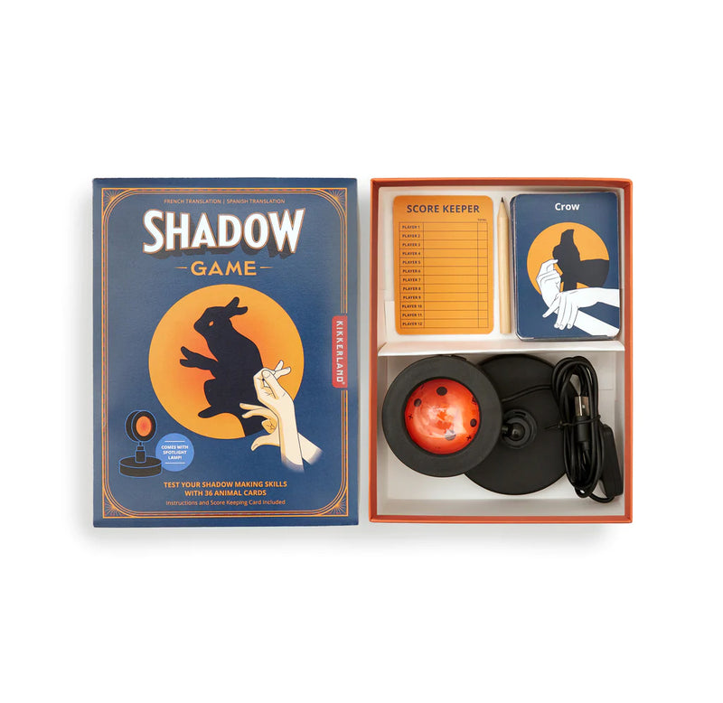 What comes in the box? A book with a hand is making a rabbit on the cover in shadow on the left. The USB-powered spotlight, animal cards, and a scorecard are on the right.