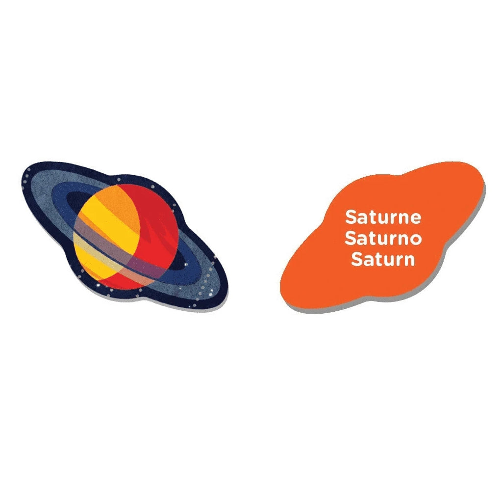 A puzzle piece of Saturn with the front a back represented. The front represents the planet in oranges, purples, and reds. The word Saturn in French, Spanish, and English is on the back.
