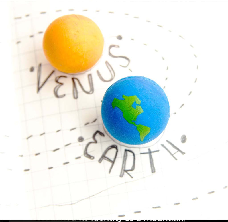A close-up image from the notebook of yellow venus and blue and green Earth.