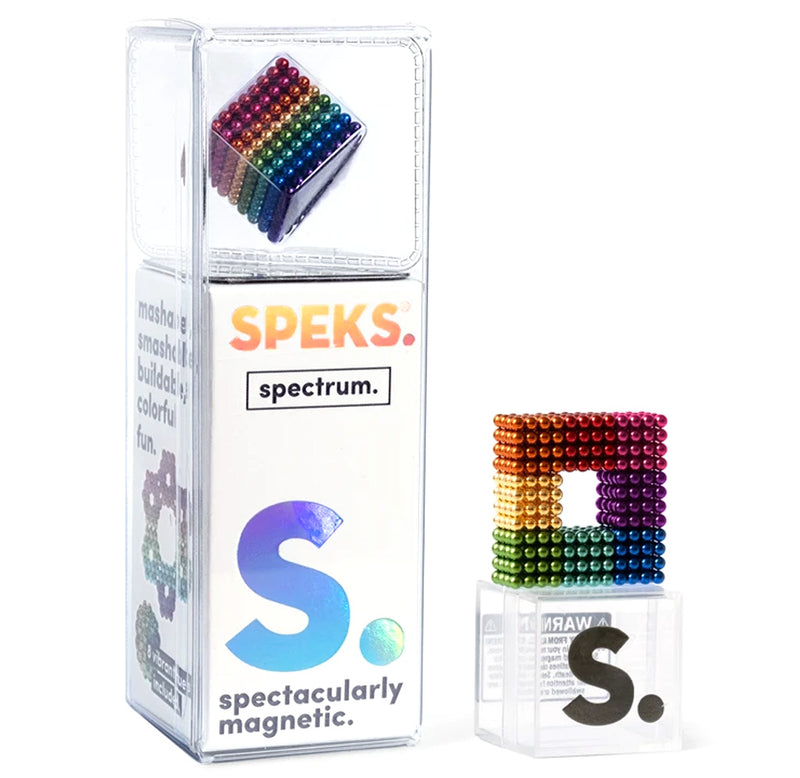 A white box with a clear top showcasing an Image of rainbow-colored magnetic balls in a square shape. A rainbow-colored magnetic ball square sits beside the box.