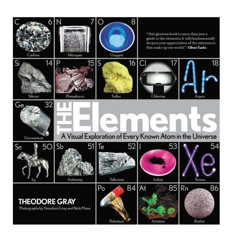 "The Elements" is a hardback book with a black cover with five rows of various chemicals with real-life visual examples.