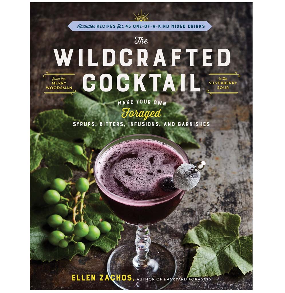 "The Wildcrafted Cocktail" is a paperback book with a  wine-colored cocktail with green herbs against a cement background on the cover.
