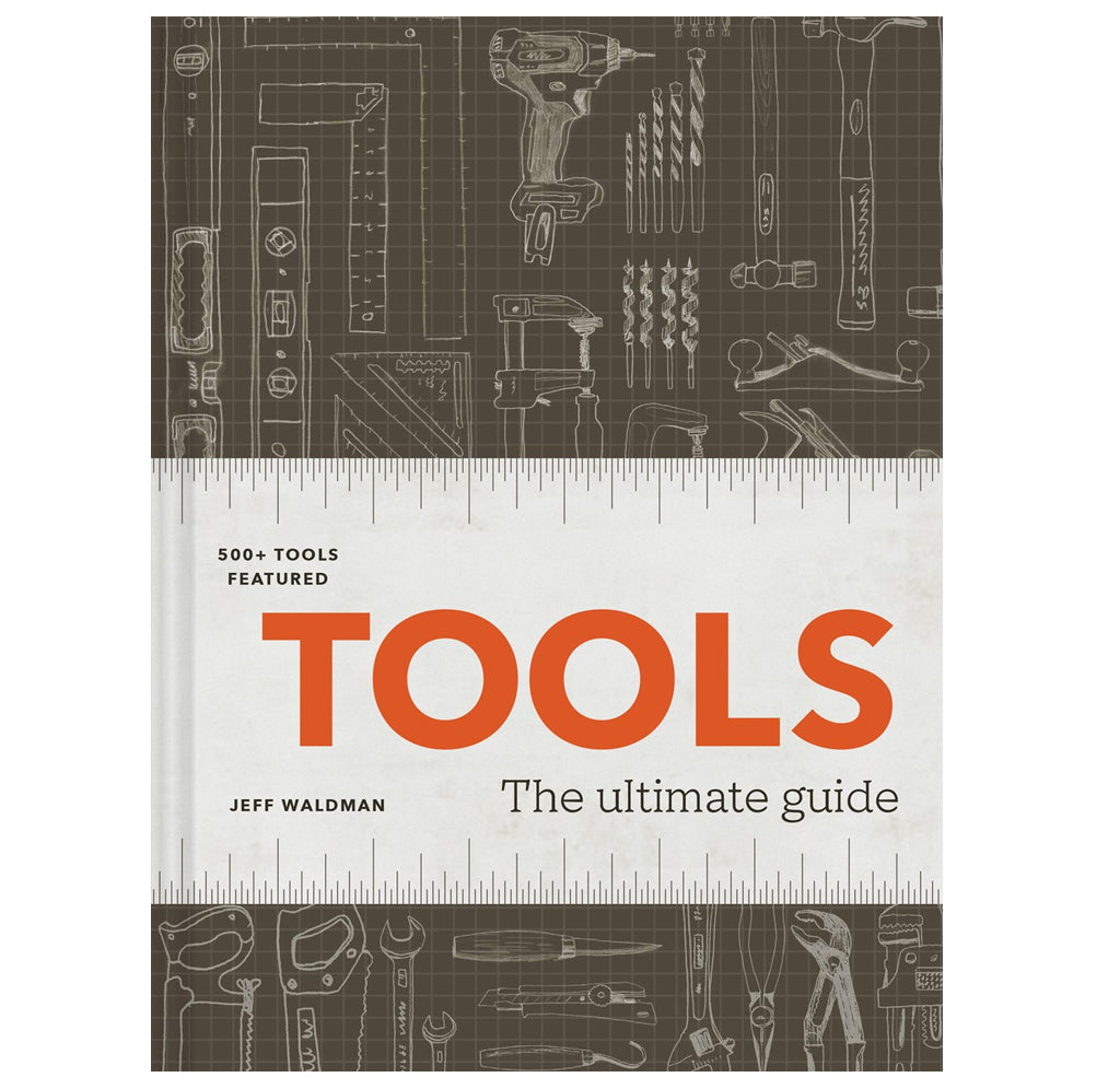 "Tools: The Ultimate Guide" is a hardcover book with a dark brown cover; different tools are drawn in a lighter brown on the surface with a white ruler to highlight the title in red. 