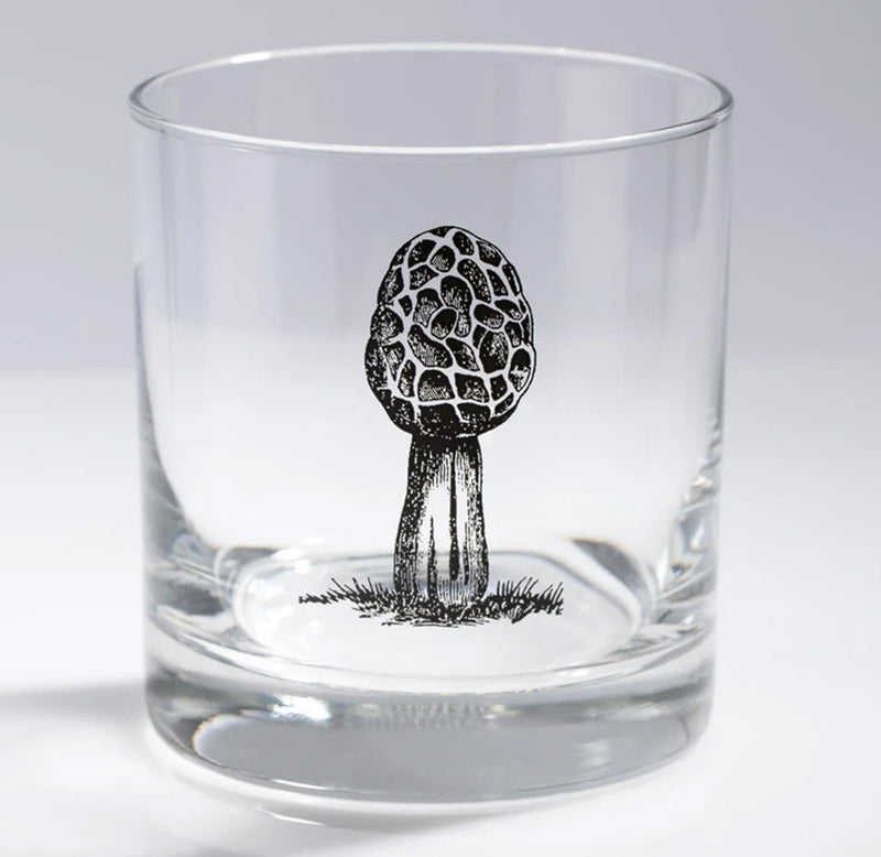 A morel mushroom in black is featured on this Whisky glass candle holder.