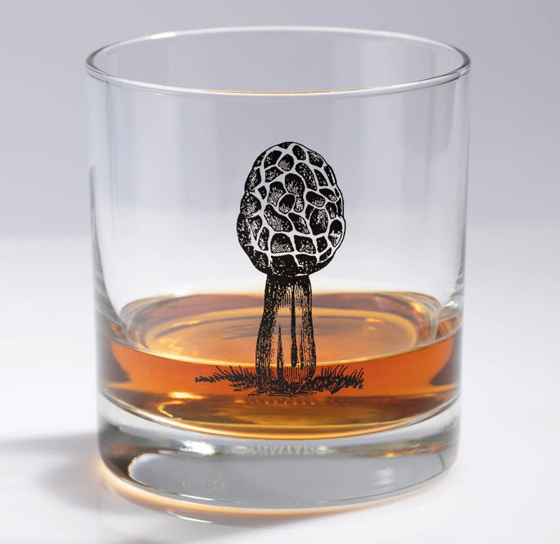 A morel mushroom in black is featured on this Whisky glass candle holder with a small shot of Whisky inside.